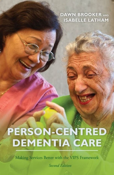 Book cover of 'Person-Centred Dementia Care' featuring two women smiling.